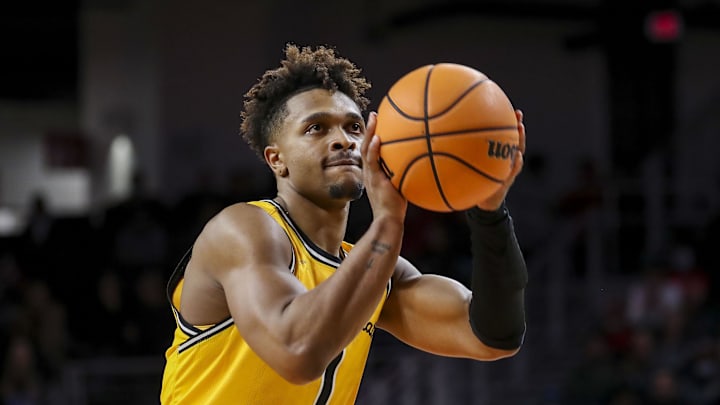 Feb 17, 2022; Cincinnati, Ohio, USA; Wichita State Shockers guard Tyson Etienne (1) shoots a free throw against the Cincinnati Bearcats in the second half at Fifth Third Arena. Mandatory Credit: Katie Stratman-Imagn Images