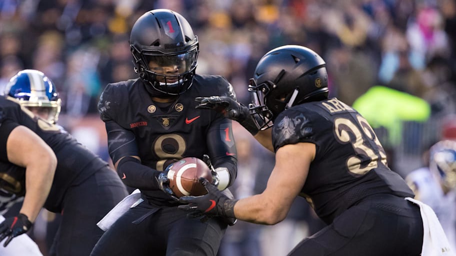 Army Black Knights quarterback Kelvin Hopkins Jr. hands off to running back Darnell Woolfolk during the 2018 Army-Navy Game.