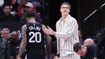 Feb 28, 2025; Salt Lake City, Utah, USA; Utah Jazz forward Lauri Markkanen (right) reacts to forward John Collins heading to the bench during the second half at Delta Center. Mandatory Credit: Rob Gray-Imagn Images