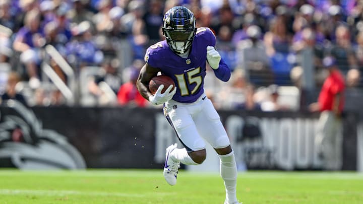 Sep 15, 2024; Baltimore, Maryland, USA; Baltimore Ravens wide receiver Nelson Agholor (15) runs with the ball during the second half against the Las Vegas Raiders at M&T Bank Stadium. Mandatory Credit: Reggie Hildred-Imagn Images