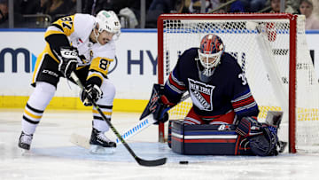 Dec 6, 2024; New York, New York, USA; New York Rangers goaltender Igor Shesterkin (31) makes a save against Pittsburgh Penguins center Sidney Crosby (87) during the second period at Madison Square Garden. Mandatory Credit: Brad Penner-Imagn Images