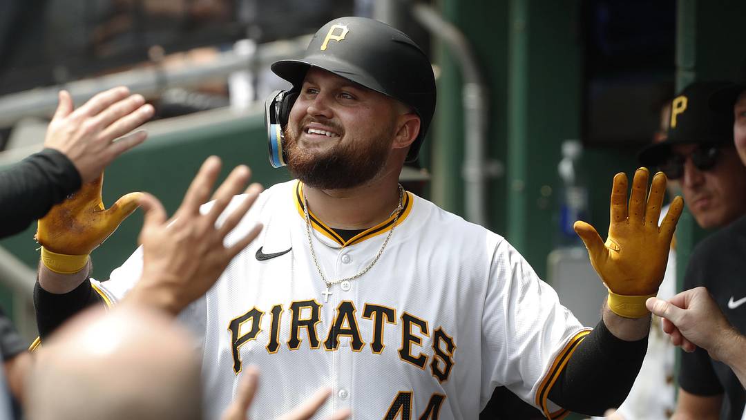 Jul 24, 2024; Pittsburgh, Pennsylvania, USA;  Pittsburgh Pirates first baseman Rowdy Tellez (44) celebrates in the dugout after hitting a solo home run against the St. Louis Cardinals during the fourth inning at PNC Park. Mandatory Credit: Charles LeClaire-Imagn Images