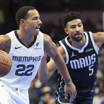 Dec 3, 2024; Dallas, Texas, USA;  Memphis Grizzlies guard Desmond Bane (22) dribbles as Dallas Mavericks guard Quentin Grimes (5) defends during the second half at American Airlines Center. Mandatory Credit: Kevin Jairaj-Imagn Images