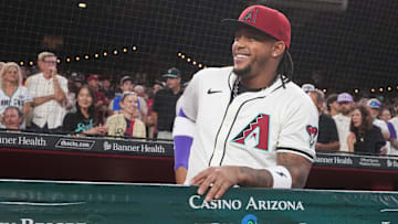 Arizona Diamondbacks infielder Ketel Marte (4) smiles from the dugout during their Opening Day game against the Chicago Cubs at Chase Field in Phoenix, on March 27, 2025.
