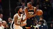 Dec 3, 2024; Phoenix, Arizona, USA; San Antonio Spurs forward Julian Champagnie (30) against Phoenix Suns forward Kevin Durant (35) during an NBA Cup game at Footprint Center. Mandatory Credit: Mark J. Rebilas-Imagn Images