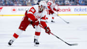 Jan 4, 2025; Winnipeg, Manitoba, CAN;  Detroit Red Wings forward Andrew Copp (18) skates into the Winnipeg Jets zone  during the first period at Canada Life Centre. Mandatory Credit: Terrence Lee-Imagn Images