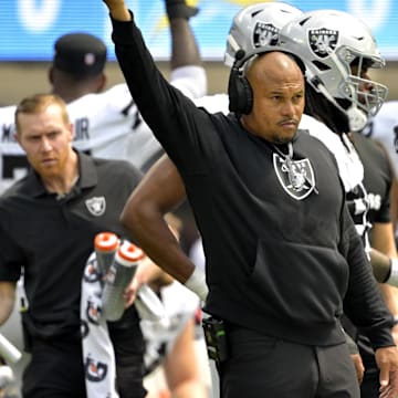 Sep 8, 2024; Inglewood, California, USA; Las Vegas Raiders head coach Antonio Pierce waves to the crowd after a play the first half against the Los Angeles Chargers at SoFi Stadium. Mandatory Credit: Jayne Kamin-Oncea-Imagn Images