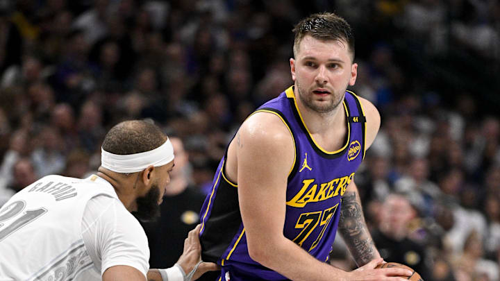 Apr 9, 2025; Dallas, Texas, USA; Dallas Mavericks center Daniel Gafford (21) and Los Angeles Lakers guard Luka Doncic (77) in action during the game between the Dallas Mavericks and the Los Angeles Lakers at American Airlines Center. Mandatory Credit: Jerome Miron-Imagn Images Apr 9, 2025; Dallas, Texas, USA; Dallas Mavericks center Daniel Gafford (21) and Los Angeles Lakers guard Luka Doncic (77) in action during the game between the Dallas Mavericks and the Los Angeles Lakers at American Airlines Center. Mandatory Credit: Jerome Miron-Imagn Images