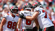 Sep 29, 2024; Tampa, Florida, USA; Tampa Bay Buccaneers tight end Cade Otton (88) congratulates quarterback Baker Mayfield (6) after a touchdown against the Philadelphia Eagles in the second quarter at Raymond James Stadium. Mandatory Credit: Nathan Ray Seebeck-Imagn Images