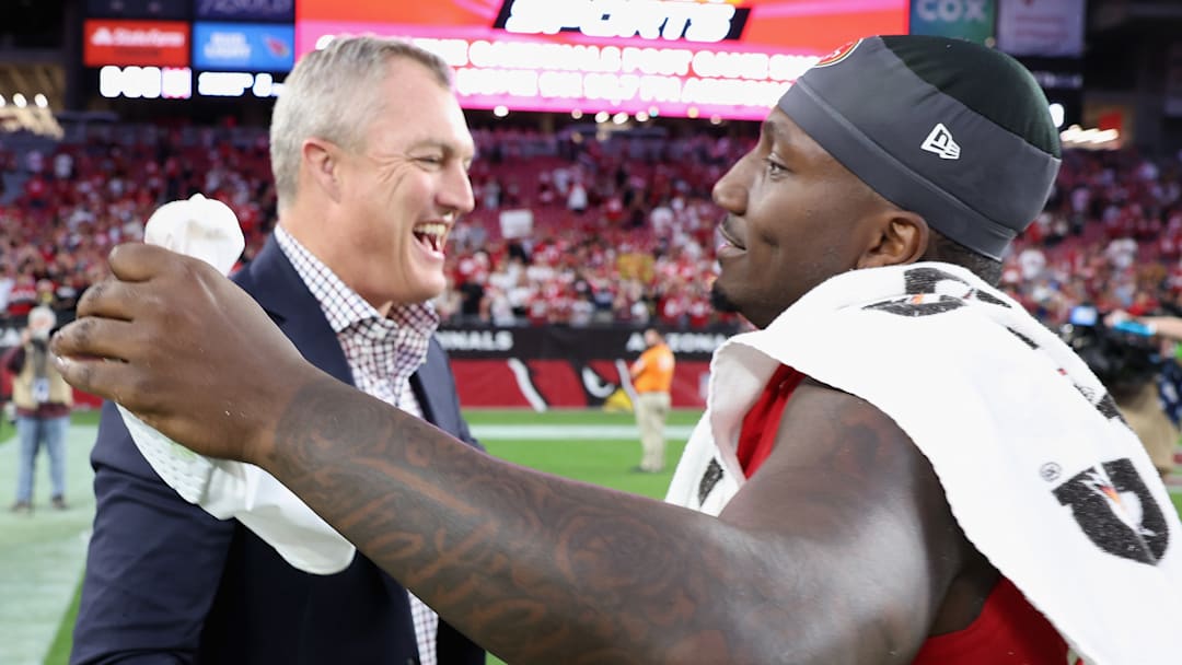 San Francisco 49ers general manager John Lynch (L) and wide receiver Deebo Samuel (R)