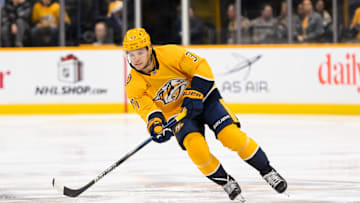 Dec 19, 2024; Nashville, Tennessee, USA;  Nashville Predators defenseman Nick Blankenburg (37) skates with the puck against the Pittsburgh Penguins during the first period at Bridgestone Arena. Mandatory Credit: Steve Roberts-Imagn Images