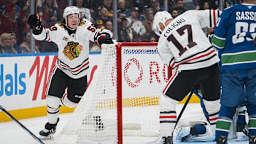 Nov 5, 2025; Vancouver, British Columbia, CAN; Chicago Blackhawks forward Nick Foligno (17) watches as forward Tyler Bertuzzi (59) celebrates his first goal of the third period against the Vancouver Canucks at Rogers Arena. Mandatory Credit: Bob Frid-Imagn Images