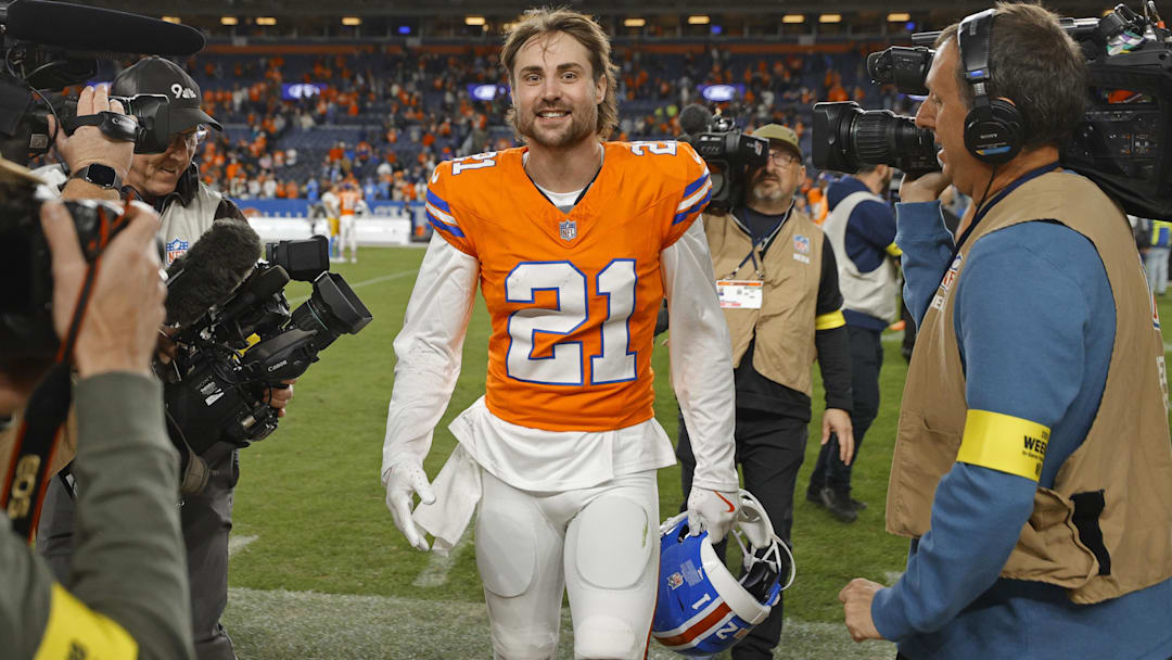 Jan 4, 2026; Denver, Colorado, USA; Denver Broncos cornerback Riley Moss (21) smiles after winning the game against the Los Angeles Chargers at Empower Field at Mile High. Mandatory Credit: Isaiah J. Downing-Imagn Images