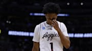 Mar 22, 2025; Denver, CO, USA; Texas A&M Aggies guard Zhuric Phelps (1) reacts after the game against the Michigan Wolverines in the second round of the NCAA Tournament  at Ball Arena. Mandatory Credit: Isaiah J. Downing-Imagn Images