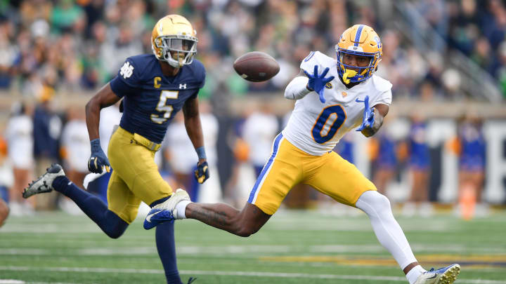 Oct 28, 2023; South Bend, Indiana, USA; Pittsburgh Panthers wide receiver Bub Means (0) catches a pass against Notre Dame Fighting Irish cornerback Cam Hart (5) in the second quarter at Notre Dame Stadium. Mandatory Credit: Matt Cashore-USA TODAY Sports