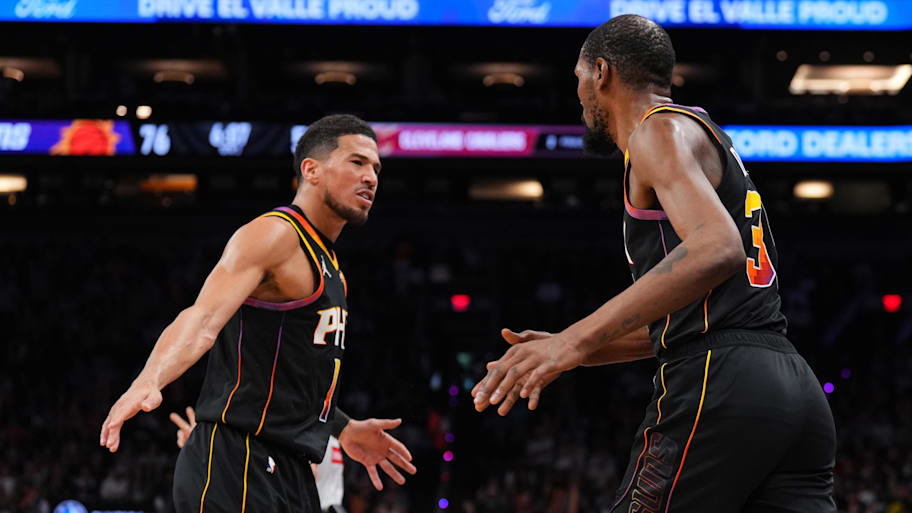 Phoenix Suns guard Booker and former Suns forward Durant high five at Footprint Center. | Joe Camporeale-Imagn Images
