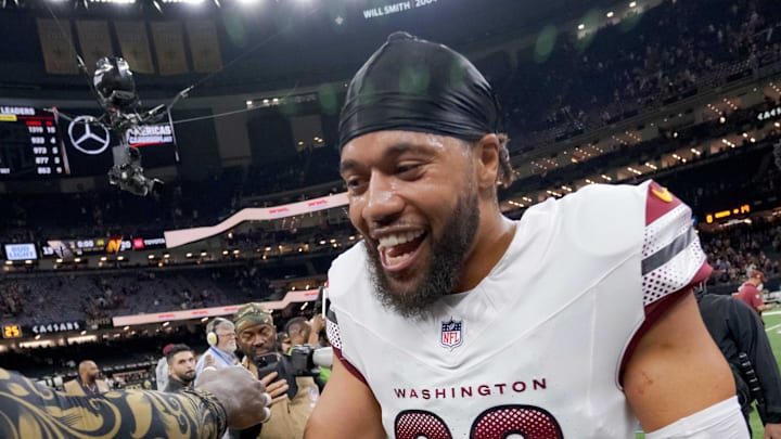 New Orleans Saints linebacker Demario Davis greets former teammate Washington Commanders cornerback Marshon Lattimore.