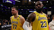 Apr 22, 2025; Los Angeles, California, USA; Los Angeles Lakers guard Luka Doncic (77) and Los Angeles Lakers forward LeBron James (23) leave a court after defeating the Minnesota Timberwolves 94-85 in game two of first round for the 2024 NBA Playoffs at Crypto.com Arena. Mandatory Credit: Kiyoshi Mio-Imagn Images
