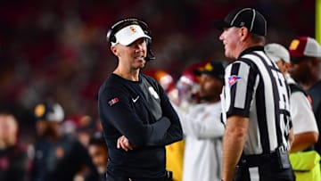 Sep 20, 2025; Los Angeles, California, USA; Southern California Trojans head coach Lincoln Riley speaks with the official during the second half at the Los Angeles Memorial Coliseum. Mandatory Credit: Gary A. Vasquez-Imagn Images