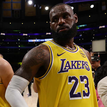 Apr 22, 2025; Los Angeles, California, USA; Los Angeles Lakers guard Luka Doncic (77) and Los Angeles Lakers forward LeBron James (23) leave a court after defeating the Minnesota Timberwolves 94-85 in game two of first round for the 2024 NBA Playoffs at Crypto.com Arena. Mandatory Credit: Kiyoshi Mio-Imagn Images