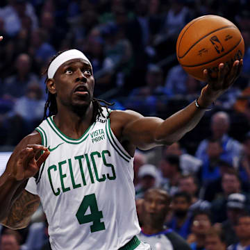 Jun 14, 2024; Dallas, Texas, USA; Boston Celtics guard Jrue Holiday (4) shoots the ball against Dallas Mavericks forward P.J. Washington (25) during game four of the 2024 NBA Finals at American Airlines Center. Mandatory Credit: Peter Casey-Imagn Images