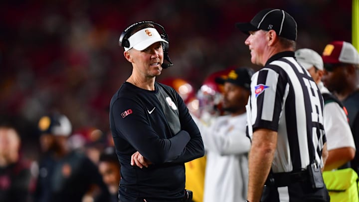 Sep 20, 2025; Los Angeles, California, USA; Southern California Trojans head coach Lincoln Riley speaks with the official during the second half at the Los Angeles Memorial Coliseum. Mandatory Credit: Gary A. Vasquez-Imagn Images