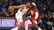 Nov 24, 2025; Phoenix, Arizona, USA; Phoenix Suns forward Dillon Brooks (3) controls the ball against Houston Rockets guard Josh Okogie (20) in the first half at Mortgage Matchup Center. Mandatory Credit: Mark J. Rebilas-Imagn Images