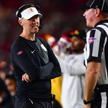 Sep 20, 2025; Los Angeles, California, USA; Southern California Trojans head coach Lincoln Riley speaks with the official during the second half at the Los Angeles Memorial Coliseum. Mandatory Credit: Gary A. Vasquez-Imagn Images