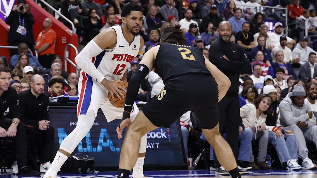 May 5, 2026; Detroit, Michigan, USA; Detroit Pistons forward Tobias Harris (12) is defended by Cleveland Cavaliers guard/forward Max Strus (2) in the second half during game one of the second round of the 2026 NBA Playoffs at Little Caesars Arena. Mandatory Credit: Rick Osentoski-Imagn Images