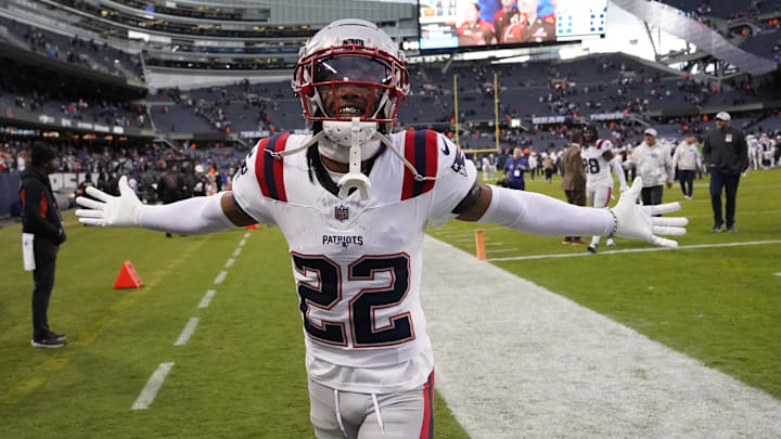 Nov 10, 2024; Chicago, Illinois, USA; New England Patriots cornerback Marco Wilson (22) celebrates the win against the Chicago Bears at Soldier Field.