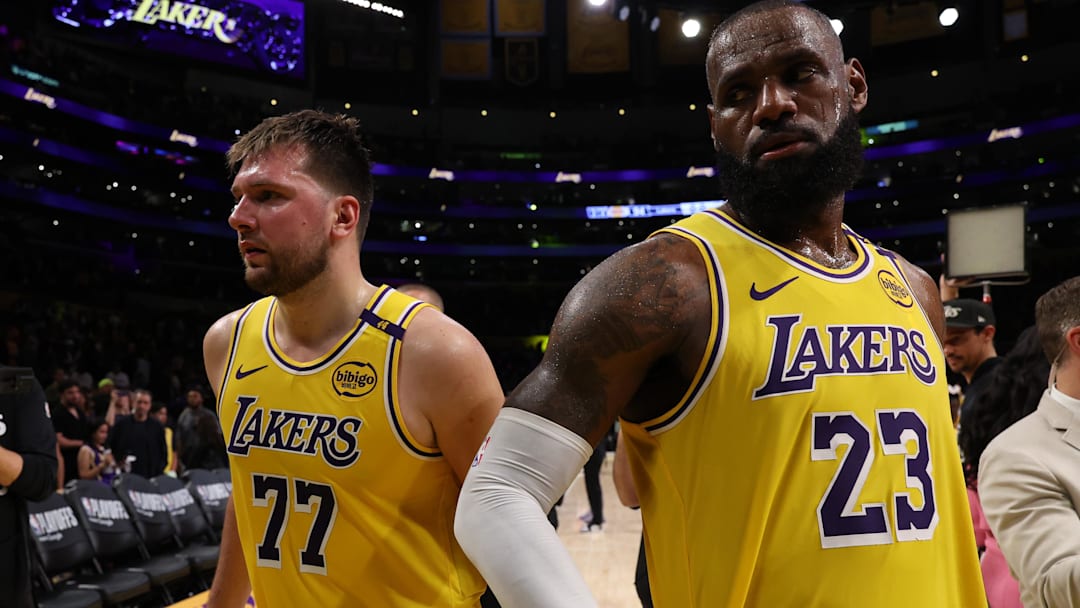 Los Angeles Lakers guard Luka Doncic (77) and Los Angeles Lakers forward LeBron James (23) leave the court after a game at Crypto.com Arena.