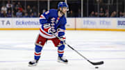 Nov 25, 2024; New York, New York, USA; New York Rangers defenseman Zac Jones (6) looks to pass against the St. Louis Blues during the second period at Madison Square Garden. Mandatory Credit: Danny Wild-Imagn Images