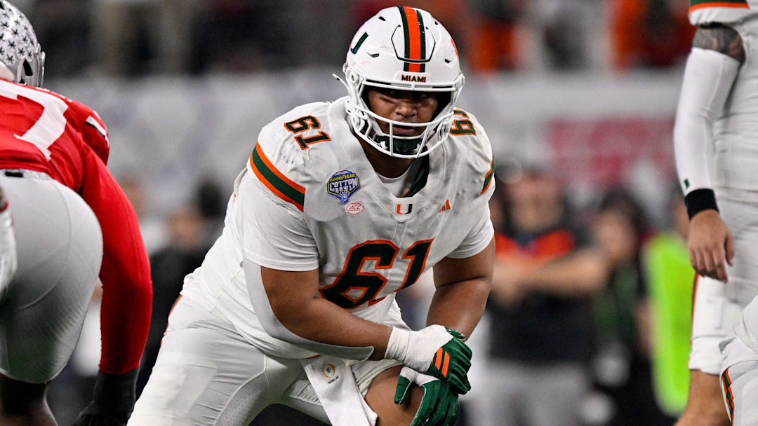 Dec 31, 2025; Arlington, TX, USA; Miami Hurricanes offensive lineman Francis Mauigoa (61) lines up during the 2025 Cotton Bowl and quarterfinal game of the College Football Playoff at AT&T Stadium.  