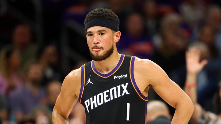 Phoenix Suns guard Devin Booker reacts against the Portland Trail Blazers in the first half during the play-in rounds of the 2026 NBA Playoffs at Mortgage Matchup Center.