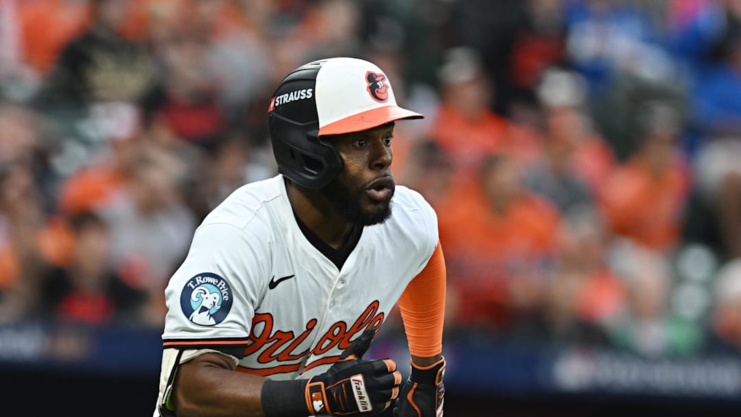 Oct 1, 2024; Baltimore, Maryland, USA; Baltimore Orioles outfielder Cedric Mullins (31) hits a double against the Kansas City Royals in game one of the Wild Card round for the 2024 MLB Playoffs at Oriole Park at Camden Yards. 