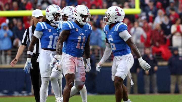 Nov 9, 2024; Oxford, Mississippi, USA; Mississippi Rebels linebacker Chris Paul Jr. (11) and linebacker TJ Dottery (6) react after a defensive stop during the first half against the Georgia Bulldogs at Vaught-Hemingway Stadium. Mandatory Credit: Petre Thomas-Imagn Images