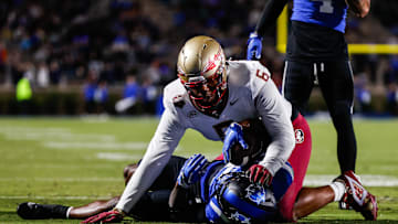 Oct 18, 2024; Durham, North Carolina, USA; Duke Blue Devils quarterback Maalik Murphy (6) attempts to run the ball to the end zone but is tacked by Florida State Seminoles defensive lineman Darrell Jackson Jr. (6) during the first half of the game at Wallace Wade Stadium. Mandatory Credit: Jaylynn Nash-Imagn Images