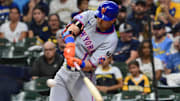 Aug 10, 2025; Milwaukee, Wisconsin, USA; New York Mets designated hitter Jeff McNeil (1) drives in a run with a base hit in the first inning against the Milwaukee Brewers at American Family Field. Mandatory Credit: Benny Sieu-Imagn Images