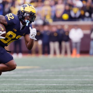 Nov 25, 2023; Ann Arbor, Michigan, USA; Michigan Wolverines wide receiver Semaj Morgan (82) runs the ball in the second half against the Ohio State Buckeyes at Michigan Stadium.