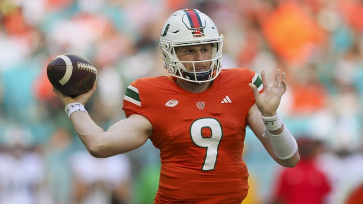 Oct 28, 2023; Miami Gardens, Florida, USA; Miami Hurricanes quarterback Tyler Van Dyke (9) throws the football against the Virginia Cavaliers during the second quarter at Hard Rock Stadium. Mandatory Credit: Sam Navarro-USA TODAY Sports