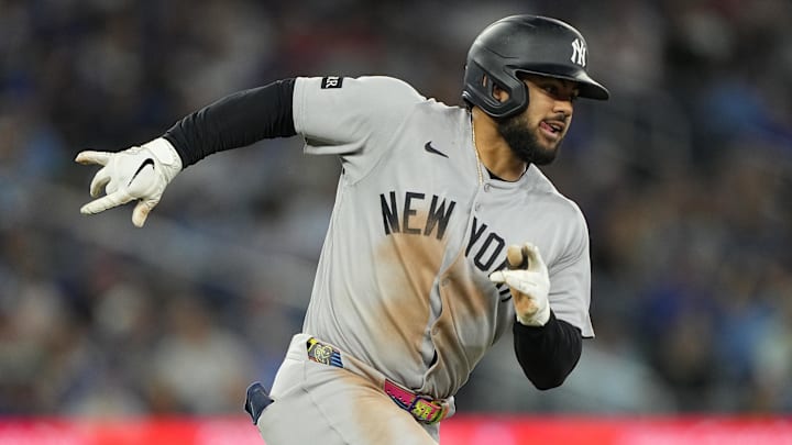 Jul 3, 2025; Toronto, Ontario, CAN; New York Yankees left fielder Jasson Dominguez (24) runs out his double against the Toronto Blue Jays during the ninth inning at Rogers Centre. Mandatory Credit: John E. Sokolowski-Imagn Images