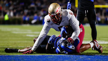 Oct 18, 2024; Durham, North Carolina, USA; Duke Blue Devils quarterback Maalik Murphy (6) attempts to run the ball to the end zone but is tacked by Florida State Seminoles defensive lineman Darrell Jackson Jr. (6) during the first half of the game at Wallace Wade Stadium. Mandatory Credit: Jaylynn Nash-Imagn Images