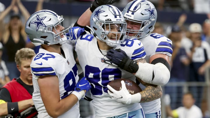 Dallas Cowboys tight end Peyton Hendershot (89) celebrates with teammates after catching a touchdown pass against the Detroit Lions.