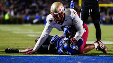 Oct 18, 2024; Durham, North Carolina, USA; Duke Blue Devils quarterback Maalik Murphy (6) attempts to run the ball to the end zone but is tacked by Florida State Seminoles defensive lineman Darrell Jackson Jr. (6) during the first half of the game at Wallace Wade Stadium. Mandatory Credit: Jaylynn Nash-Imagn Images