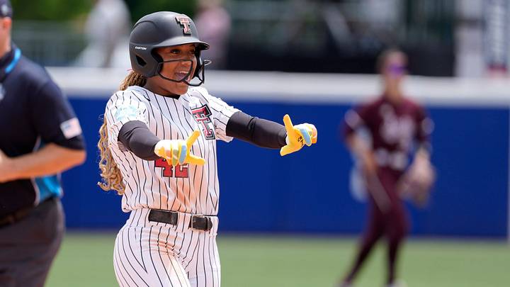 Texas Tech Red Raiders outfielder Mihyia Davis (42) celebrates after Texas Tech's run-rule victory during a Women's College World Series softball game between the Texas Tech Red Raiders and the Mississippi State Bulldogs at Devon Park in Oklahoma City, Thursday, May 28, 2026. Texas Tech won 8-0.