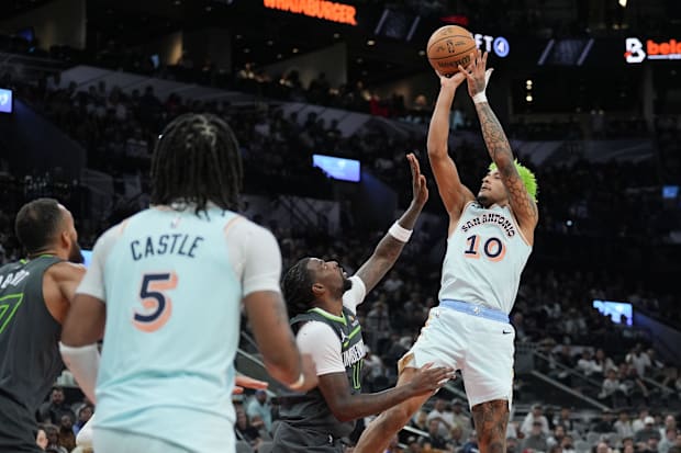 San Antonio Spurs forward Jeremy Sochan shoots over Minnesota Timberwolves center Naz Reid in the second half at Frost Bank