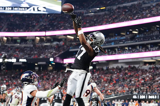 Jan 7, 2024; Paradise, Nevada, USA; Raiders’ Davante Adams leaps for a catch vs. Broncos.