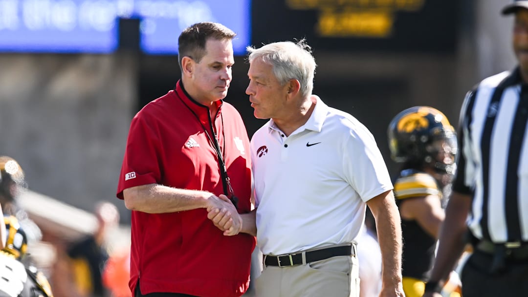 Sep 27, 2025; Iowa City, Iowa, USA; Iowa Hawkeyes head coach Kirk Ferentz and Indiana Hoosiers head coach Curt Cignetti shake hands before the game at Kinnick Stadium. Mandatory Credit: Jeffrey Becker-Imagn Images