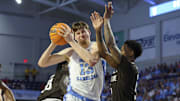 Nov 25, 2025; Fort Myers, Florida, USA; North Carolina Tar Heels center Henri Veesaar (13) is guarded by St. Bonaventure Bonnies guard Dasonte Bowen (5) in the first half at Suncoast Credit Union Arena. Mandatory Credit: Nathan Ray Seebeck-Imagn Images