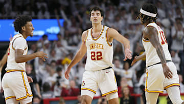 Iowa State cyclones forward Milan Momcilovic (22) celebrates with Iowa State cyclones guard Curtis Jones (5) and Iowa State cyclones guard Keshon Gilbert (10) after making a three-point shot against Marquette during the first half in the NCAA men’s basketball at Hilton Coliseum on Wednesday, Dec. 4, 2024, in Ames, Iowa.